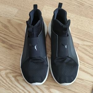 Black Puma sneakers